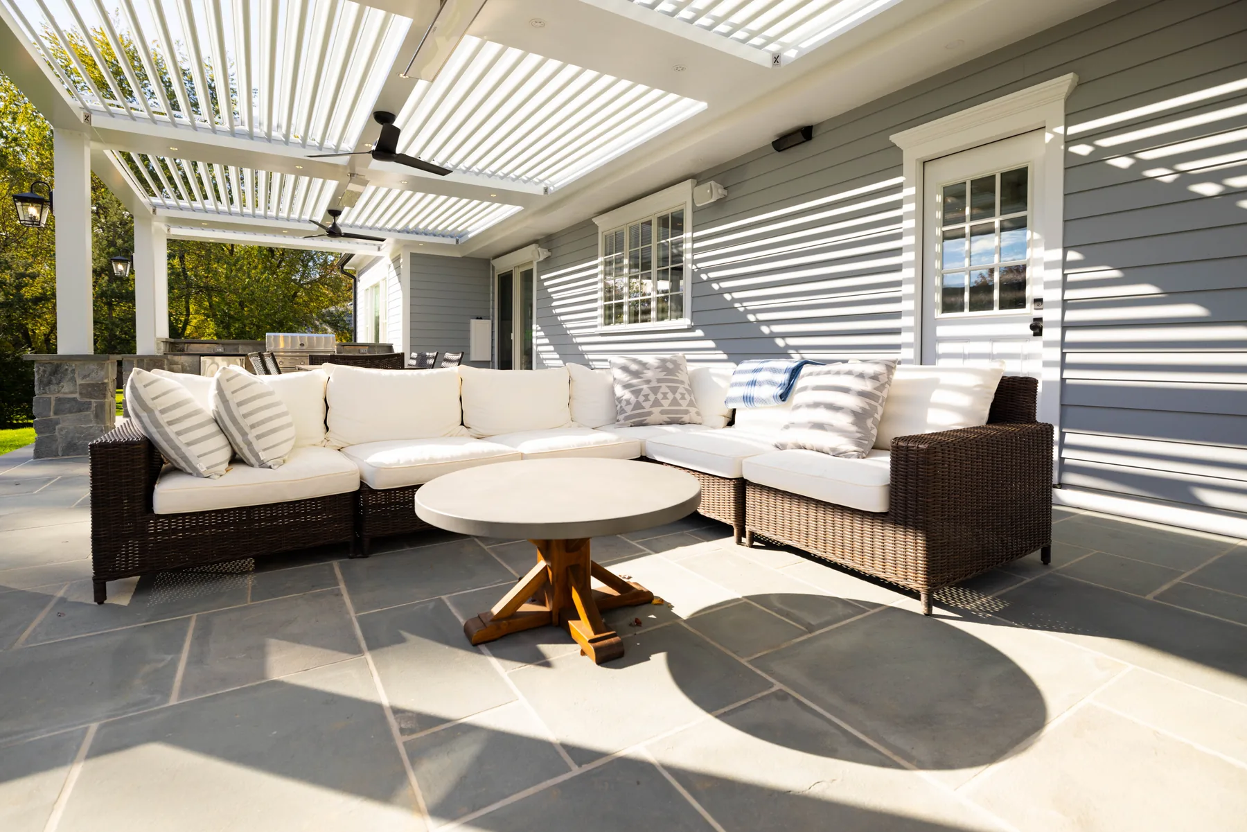 White pergola lounge with outdoor sofa