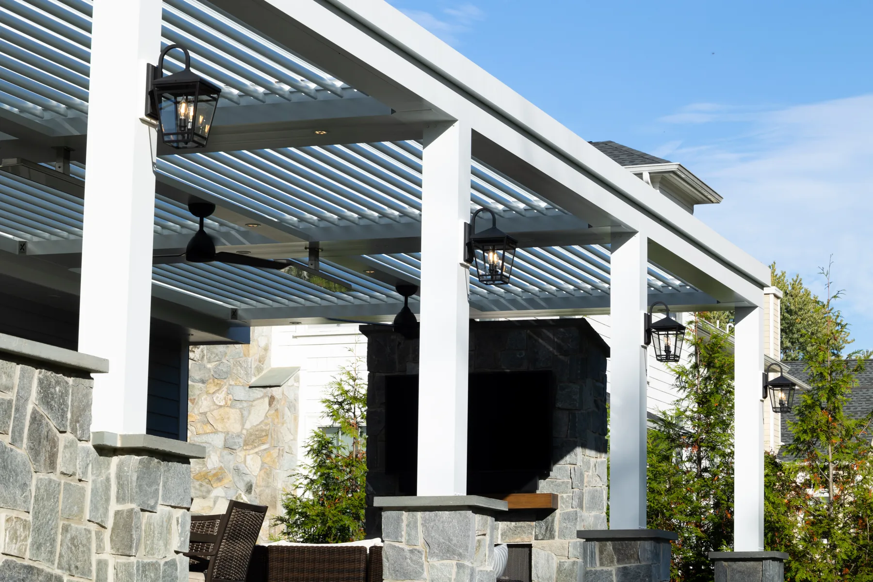 White louvered roof attached to a house