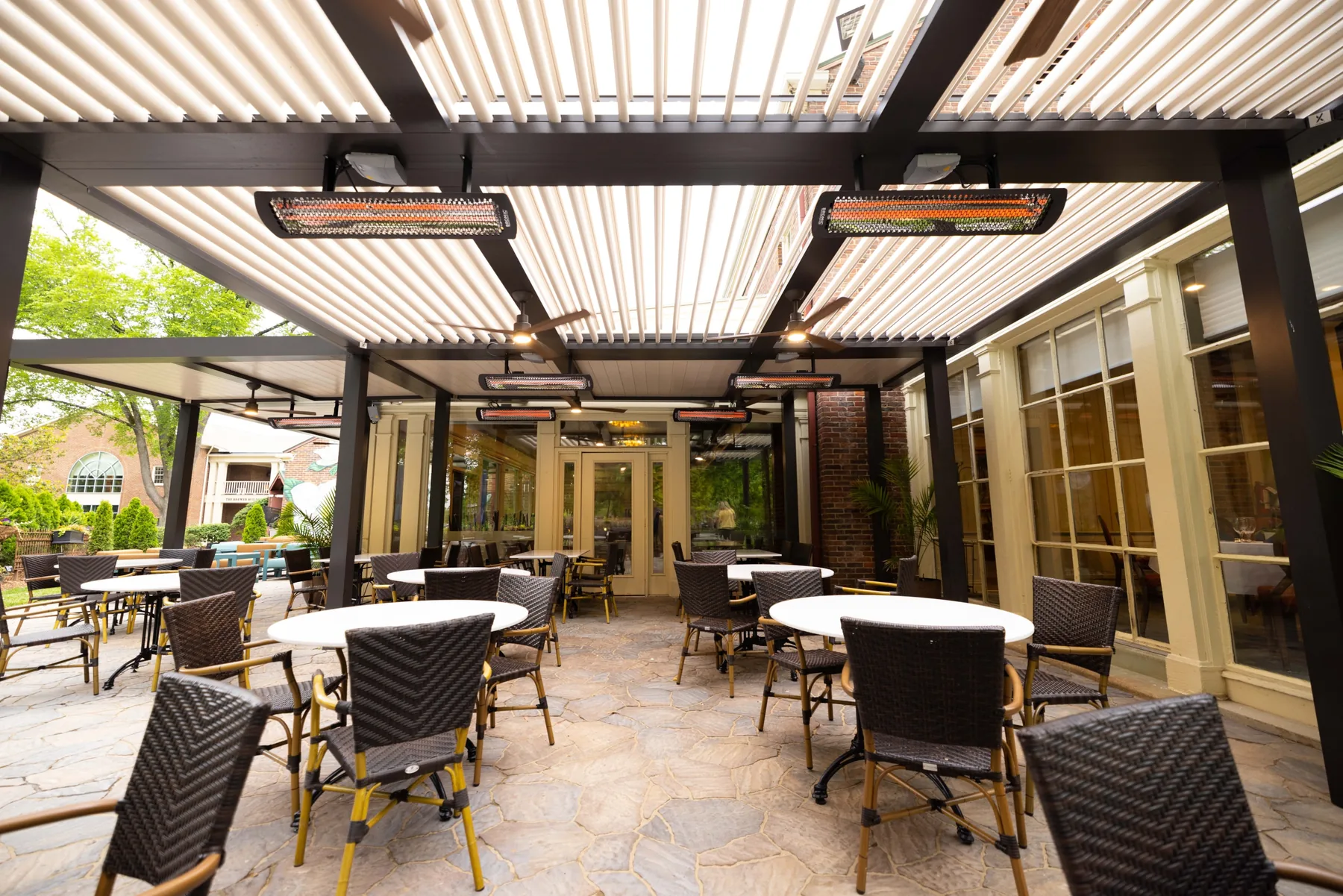Covered restaurant terrace with dining tables