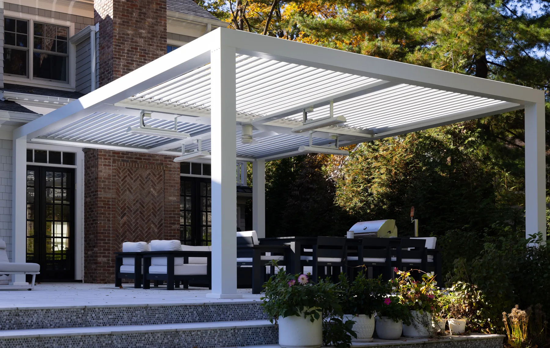 White pergola attached to classic home facade