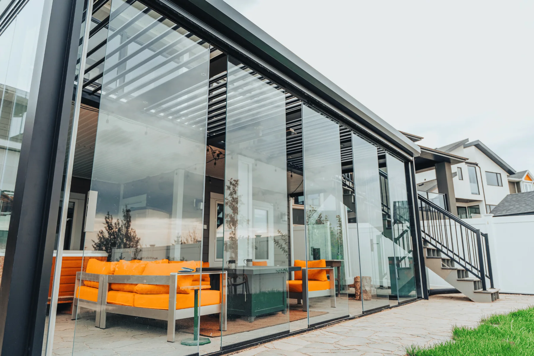 Glass enclosed pergola for resort spaces