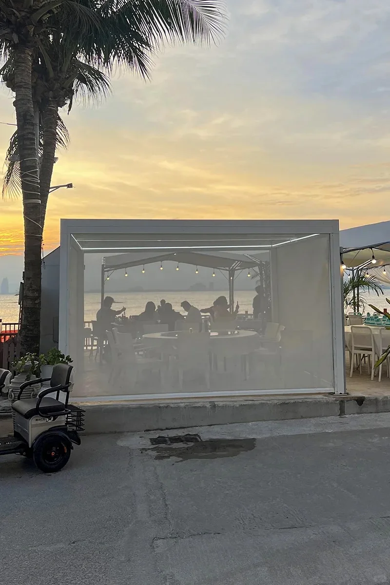 Beachfront pergola with side screen enclosure